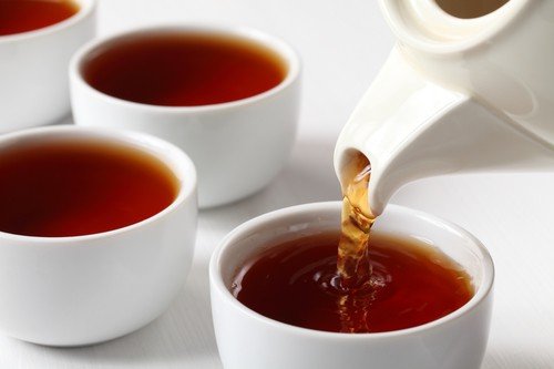 Pour your Assam black tea into porcelain cups